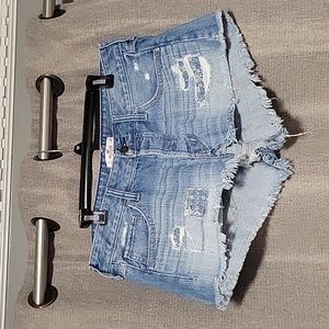 Hollister cut off distressed denim jean shorts, size 11. Waist 30. 100% cotton.